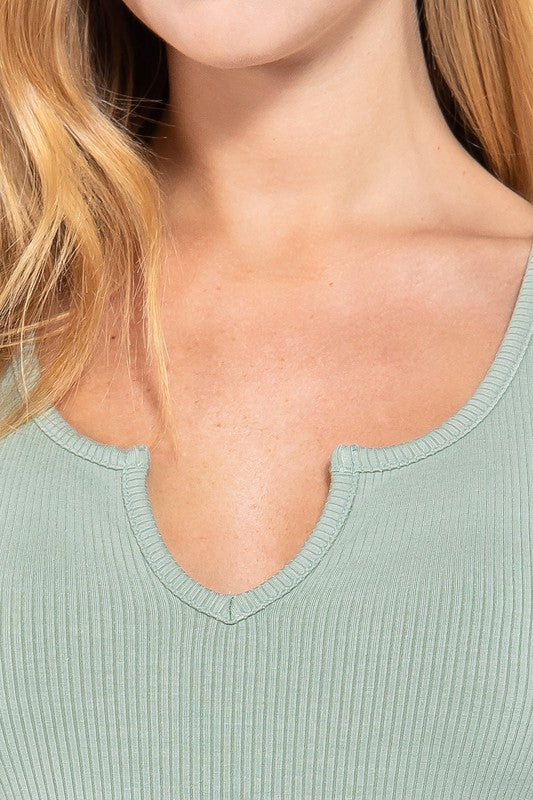 rib knit short sleeve top has a notched detail