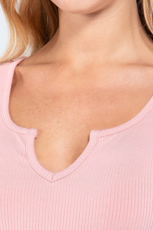 rib knit short sleeve top has a notched detail