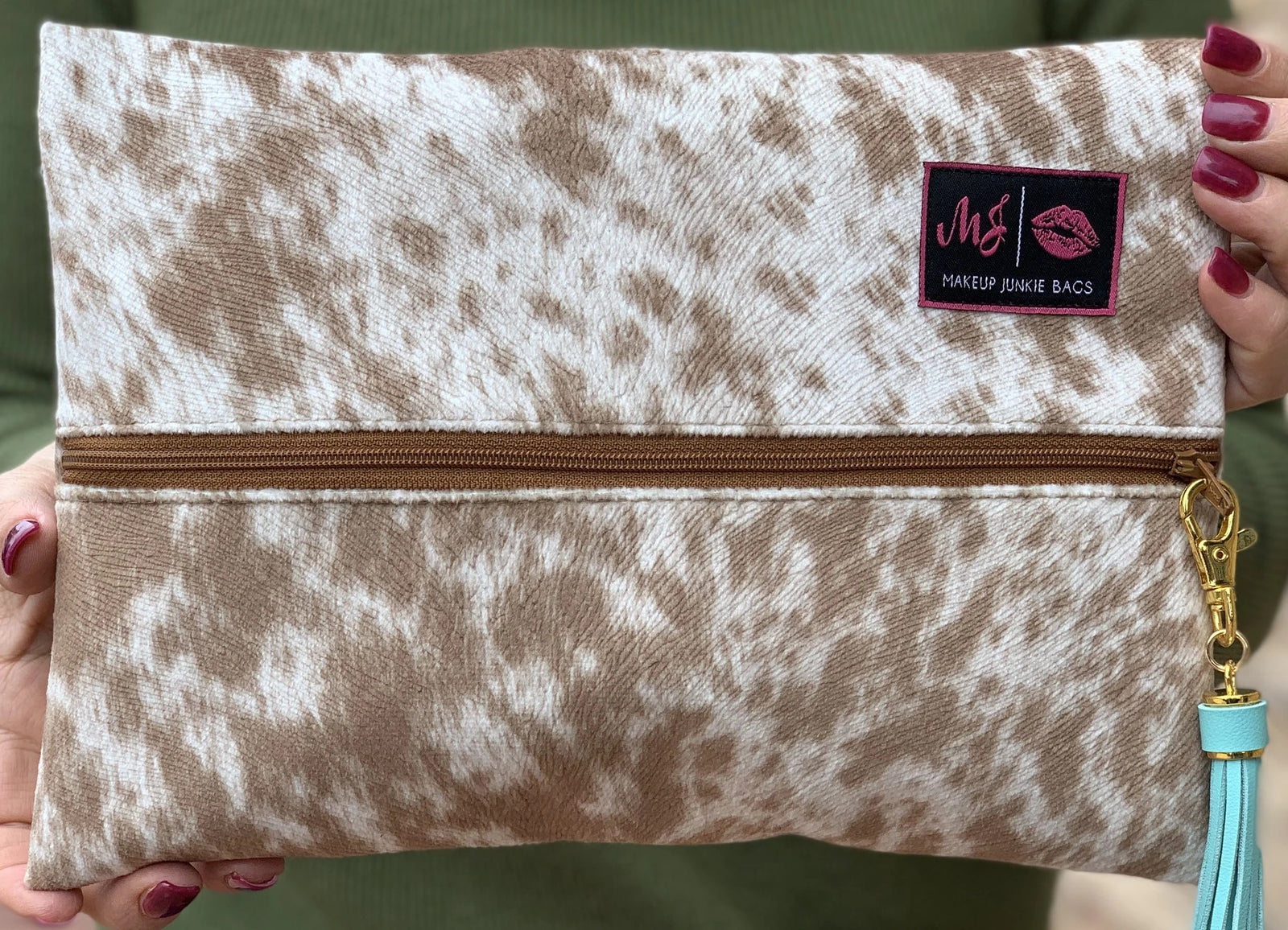 The Makeup Junkie Lola Tan Cow print bag